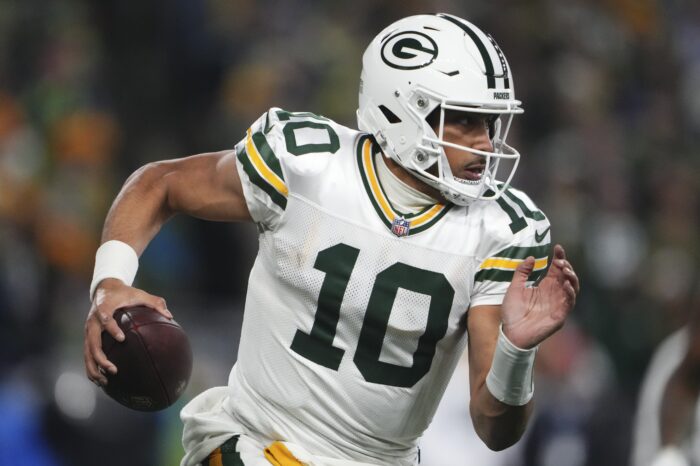 Green Bay Packers' Jordan Love runs during the second half of an NFL football game against the Seattle Seahawks Sunday, Dec. 15, 2024, in Seattle. (AP Photo/Lindsey Wasson)